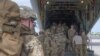 U.S. Army soldiers begin a mission to bolster the security of Manda Bay Airfield, Kenya after an attack by Somalia's al Shabaab militants, board a transport plane in Camp Lemonnier, Djibouti, Jan.5, 2020.