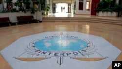 FILE - The entrance hall of Interpol's headquarters in Lyon, central France. 