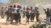 Police forcefully disburse students protesting for education reforms, in Letpadan, 140 kilometers north of Yangon, Myanmar, March 10, 2015. (Sithu Naina/VOA)