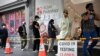 People queue at a walk-in coronavirus disease (COVID-19) testing site in Melbourne, Australia January 5, 2022. 