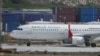 FILE - A passenger airplane sits at the airport in Mogadishu, Somalia, Feb. 3, 2016. The country's aviation authorities have banned multiple types of Antonov planes, effective March 15, 2019. 