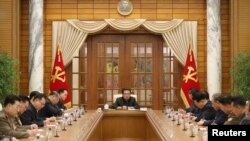 North Korean leader Kim Jong Un attends the 5th Political Bureau Meeting of the 8th Central Committee of the Workers' Party of Korea (WPK) at the Party Central Committee office building in Pyongyang, North Korea, Dec. 1, 2021.