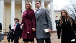 FILE - Donald Trump Jr., wife Vanessa Trump, and their children Donald Trump III, left, and Kai Trump, right, walk out together after attending church service at St. John's Episcopal Church across from the White House in Washington.