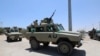 FILE - African Union Mission in Somalia (AMISOM) peacekeepers travel in an armored vehicle in Mogadishu, Somalia. Feb. 28, 2019.