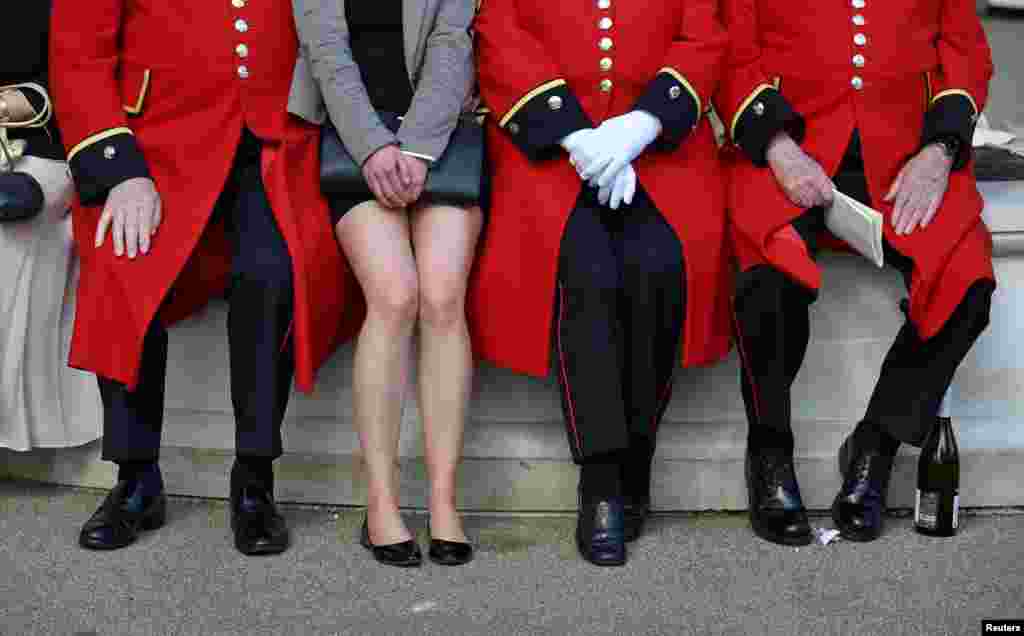 Chelsea pensioners pose with a racegoer at the Royal Ascot horse race in Britain.