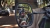 A French soldier is reflected in the mirror of a military jeep in Niono, Mali, January 20, 2013.