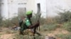 FILE - An African Union Mission in Somalia (AMISOM) peacekeeper from Burundi holds a position before being replaced by the Somali military at Jaale Siad Military academy in Mogadishu, Somalia. Feb. 28, 2019.