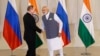 Indian Prime Minister Narendra Modi, right, shakes hand with Russian President Vladimir Putin prior to their bilateral meeting, in Goa, India, Oct. 15, 2016. The two leaders signed several agreements as part of apparent efforts aimed at rejuvenating ties.