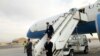 Caption U.S. Defense Secretary Mark Esper, center, arrives in Kabul, Afghanistan, Oct. 20, 2019. 