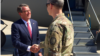 Secretary of Defense Ash Carter is greeted by U.S. General McFarland upon arriving in Baghdad, April 18, 2016. (C. Babb/VOA)