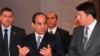 In this photo provided by Egypt's state news agency MENA, Egyptian President Abdel-Fattah el-Sissi, center, escorts Italian Prime Minister Matteo Renzi, right, to a joint press conference, in the presidential palace in Cairo, Aug. 2, 2014