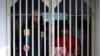 FILE - Jailed Taliban fighters are seen inside the Pul-e-Charkhi prison in Kabul, Afghanistan, Dec. 14, 2019. 