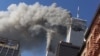 FILE - In this Sept. 11, 2001 file photo, smoke rising from the burning twin towers of the World Trade Center after hijacked planes crashed into the towers, in New York City. 