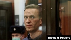 FILE - Russian opposition leader Navalny attends a court hearing in Moscow, Feb 25, 2021.