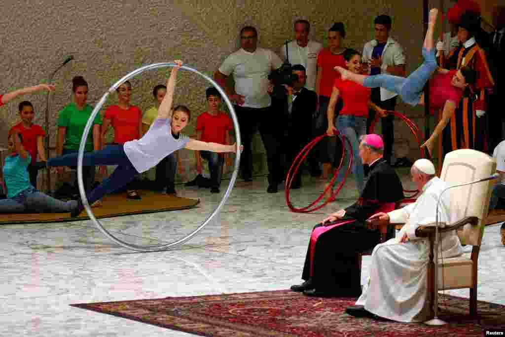 Artists perform in front of Pope Francis during a Jubilee audience for the circus performers and street artists in Paul VI Hall at the Vatican.