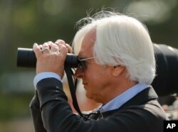 Trainer Bob Baffert watches Triple Crown hopeful Justify work out at Belmont Park, June 8, 2018, in Elmont, N.Y.