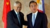 Chinese Foreign Minster Wang Yi (R) is greeted by Philippine Foreign Secretary Albert Del Rosario upon arrival at the Department of Foreign Affairs, Nov. 10, 2015, at suburban Pasay city, south of Manila, Philippines.