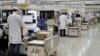 FILE - Employees work at a mobile phone production line at a Huawei factory in Shenzhen city, in southern China's Guangdong province, Jan. 15, 2019.