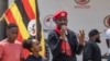 Bobi Wine (katikati), akitoa hotuba akiwa na binti yake Suubi na mtoto wake wa kiume Shadrack Mbogo huko Kampala on January 26, 2024. Picha na AFP 