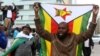 Protesters gather calling for Zimbabwean President Robert Mugabe to step down, in Harare, Zimbabwe, Nov. 18, 2017.