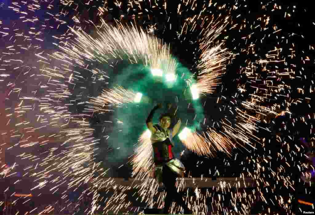 An artist performs during the annual Kyiv Fire Fest in Kyiv, Ukraine, June 11, 2016.