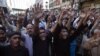 Shi'ite Muslim men shout slogans during a protest rally organised by the religious group Majlis-e- Wahdat-e-Muslimeen (MWM) in Karachi, January 11, 2013, to condemn the bomb blasts in Quetta a day earlier, and the killings of Shiites. 