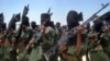FILE - Fighters loyal to Somalia’s al-Shabab group perform military drills at a village in Lower Shabelle region, some 25 kilometers outside Mogadishu, Feb. 17, 2011.