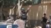 Afghan security forces near entrance gate of presidential palace in Kabul, June 25, 2013.