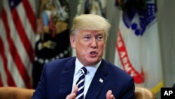 Presiden Donald Trump berbicara mengenai kota-kota perlindungan imigran kepada penegak hukum di Gedung Putih, Washington, 20 March 2018.