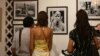 Audiences view exhibited photos portraying the livelihood of indigenous people in Ratanakiri province.
