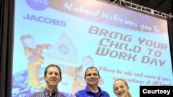 From L to R: Kelley Easley, NASA astronaut Tony Antonelli, and Erin Easley on 'Take Your Child to Work' day at the Michoud Assembly Facility on June 7, 2012.