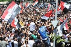 Des partisans du président Assad à Damas
