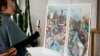 FILE - Journalists take pictures of the Paris 2024 Olympic and Paralympic posters in Ivry-sur-Seine, France, on Feb. 20, 2024. France announced on March 5 that potential security threats mean that tourists will not be able to attend the opening ceremonies.