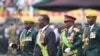 UMongameli Emmerson Mnangagwa, umsekeli wakhe uRetired General Constantino Chiwenga lenkokheli yebutho. (AP Photo/Tsvangirayi Mukwazhi)