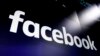 FILE - This March 29, 2018, photo shows the logo for Facebook on screens at the Nasdaq MarketSite, in New York's Times Square.