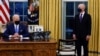 President Biden signs executive orders on immigration reform inside the Oval Office at the White House in Washington