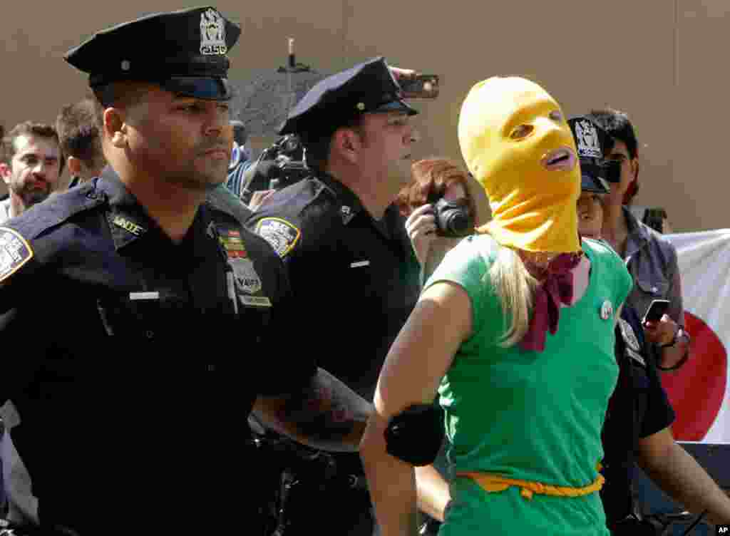 A protester is arrested in front of the Russian consulate in New York.