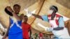 People coming from Congo have their temperature measured to screen for symptoms of Ebola, at the Mpondwe border crossing with Congo, in western Uganda, June 14, 2019.