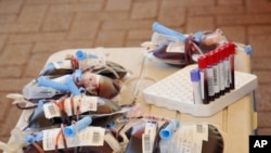 FILE - Bags of donated blood are seen at a blood-donation drive organized by the Rotary club and Uganda Blood Transfusion Services in City Square, Kampala, Uganda, Sept. 19, 2020.