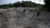 Kids play on piles of imported plastic waste in Mojokerto, East Java province, Indonesia, June 19, 2019.