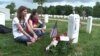 Soldiers Place US Flags in Arlington Cemetery for Memorial Day