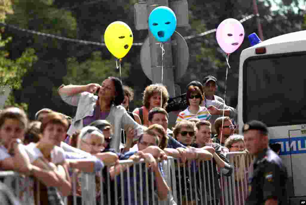 Pussy Riot supporters behind barricades surrounding a court in Moscow.