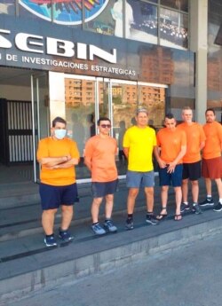 FILE - This undated photo posted on Twitter on June 18, 2020, by Venezuela's foreign minister shows, from left, CITGO executives Jose Angel Pereira, Gustavo Cardenas, Jorge Toledo, Jose Luis Zambrano, Tomeu Vadell and Alirio Jose Zambrano in Caracas.