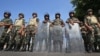 Egyptian soldiers stand guard near the Republican Guard headquarters, Cairo, July 19, 2013.