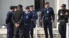 FILE - Pakistani policemen stand guard in front of the Supreme Court building during the court review appeal against a Pakistani Christian woman who spent eight years on death row for blasphemy, in Islamabad on Jan. 29, 2019.