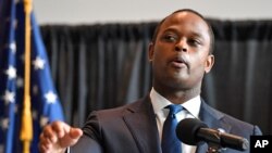 FILE - Kentucky Attorney General Daniel Cameron addresses the media following the return of a grand jury investigation into the death of Breonna Taylor, in Frankfort, Kentucky, Sept. 23, 2020.