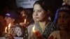 Women hold lighted candles during a rally condemning the attack on schoolgirl Malala Yousufzai, in Karachi, Pakistan, October 11, 2012.