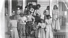 Patients at Tuberculosis Sanitorium with glasses of milk, Phoenix Indian School, c. 1890-1910. 