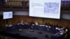The panel is shown images of what witnesses say are re-education camps in China on the first day of hearings at the "Uyghur Tribunal", a panel of UK-based lawyers and rights experts investigating alleged abuses in China, in London on June 4, 2021.
