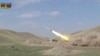A still image from a video released by Azerbaijan's Defence Ministry shows a multiple rocket launcher of the Azeri armed forces performing strikes during clashes over the breakaway region of Nagorno-Karabakh in Azerbaijan, Sept. 30, 2020.